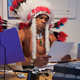 Arizona State’s Navajo tracker briefly scans a list of outstanding library fines before setting off to trail a graduate.